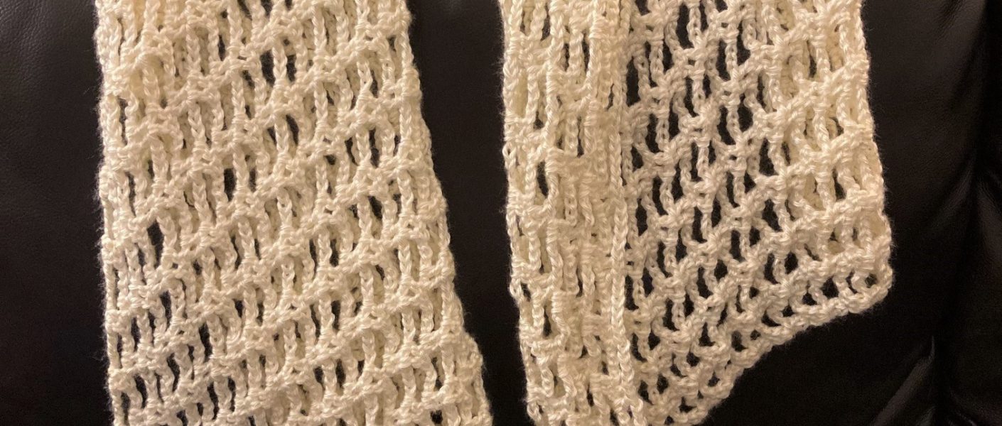 White crochet shawl draped