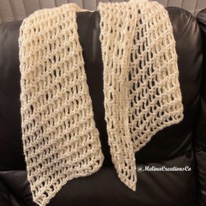 White crochet shawl draped