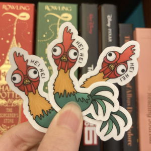 Three displayed Hei Hei stickers